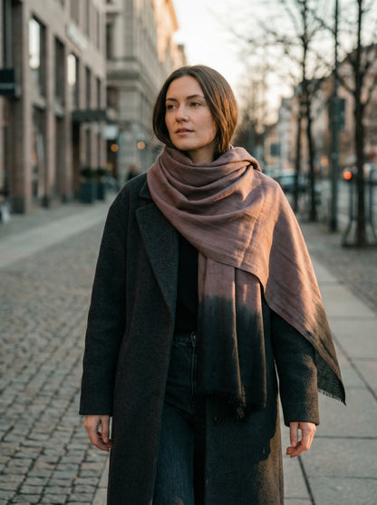 Cinerous grey Tagelmust styled as a lightweight travel scarf for women, Touareg inspired Moroccan headscarf ideal for safari adventures and warm desert climates.