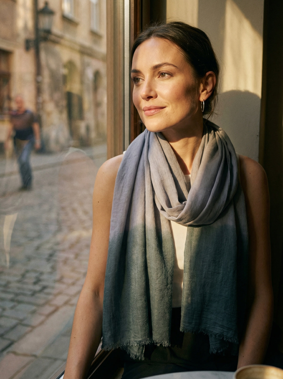 Taupe grey Tagelmust styled as a lightweight travel scarf for women, Touareg inspired Moroccan headscarf ideal for safari adventures and warm desert climates.