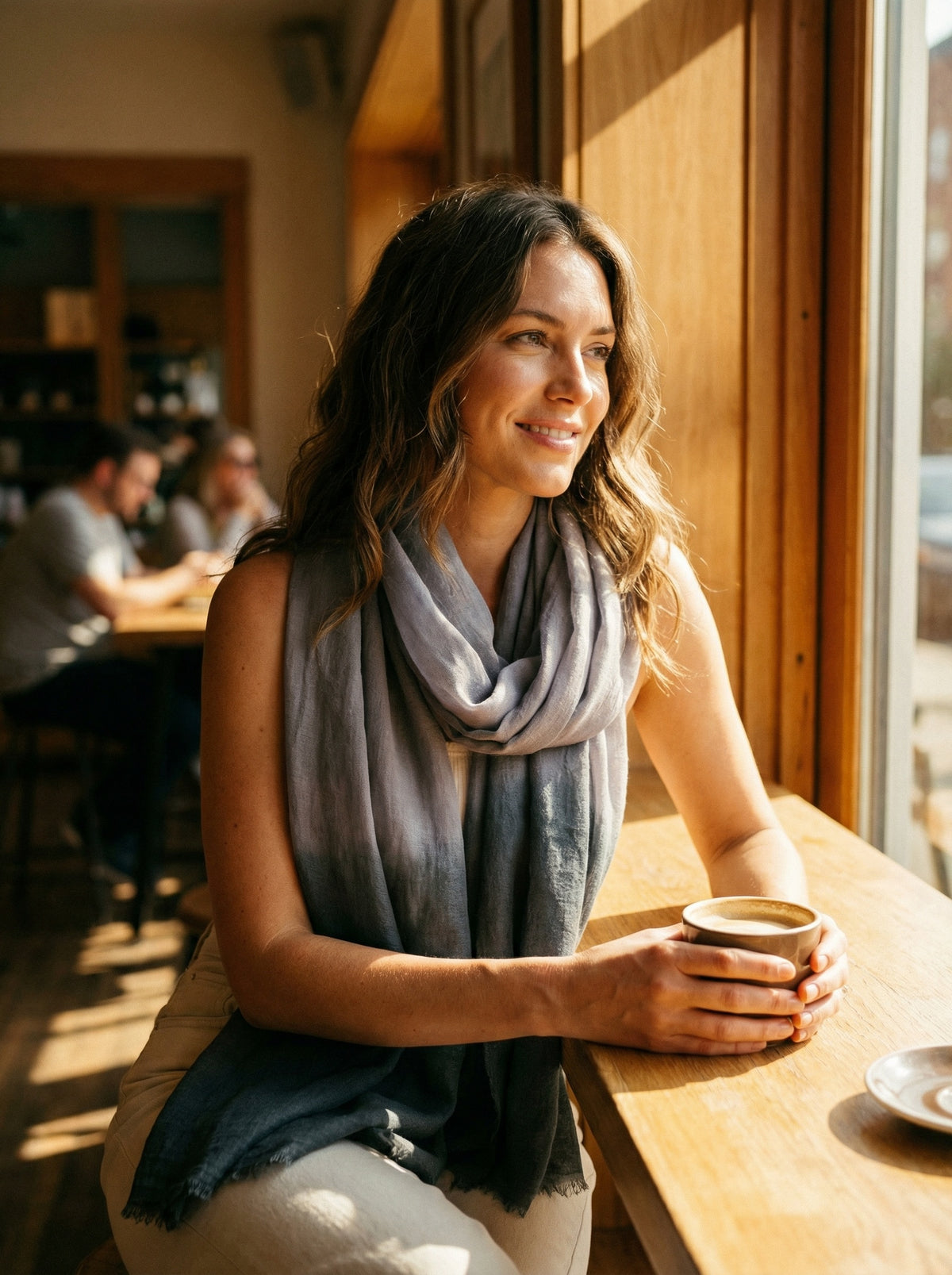 Taupe grey Tagelmust styled as a lightweight travel scarf for women, Touareg inspired Moroccan headscarf ideal for safari adventures and warm desert climates.