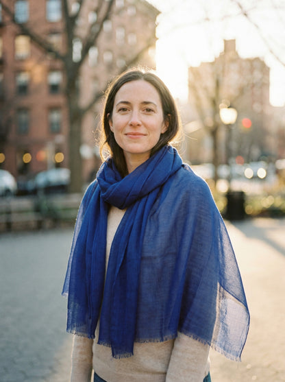 Original Indigo Tagelmust styled as a lightweight safari scarf for women, Touareg inspired desert headscarf for warm climate exploration.