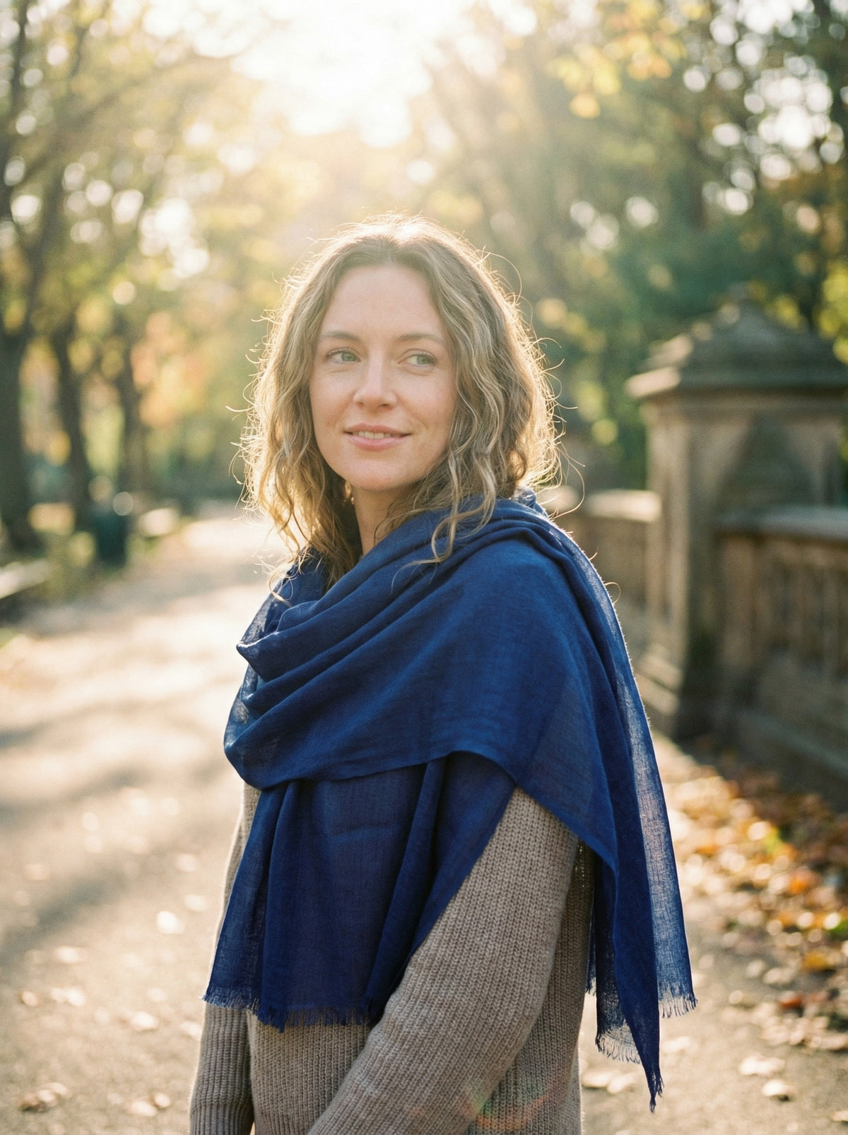 Original Indigo Tagelmust styled as a lightweight safari scarf for women, Touareg inspired desert headscarf for warm climate exploration.
