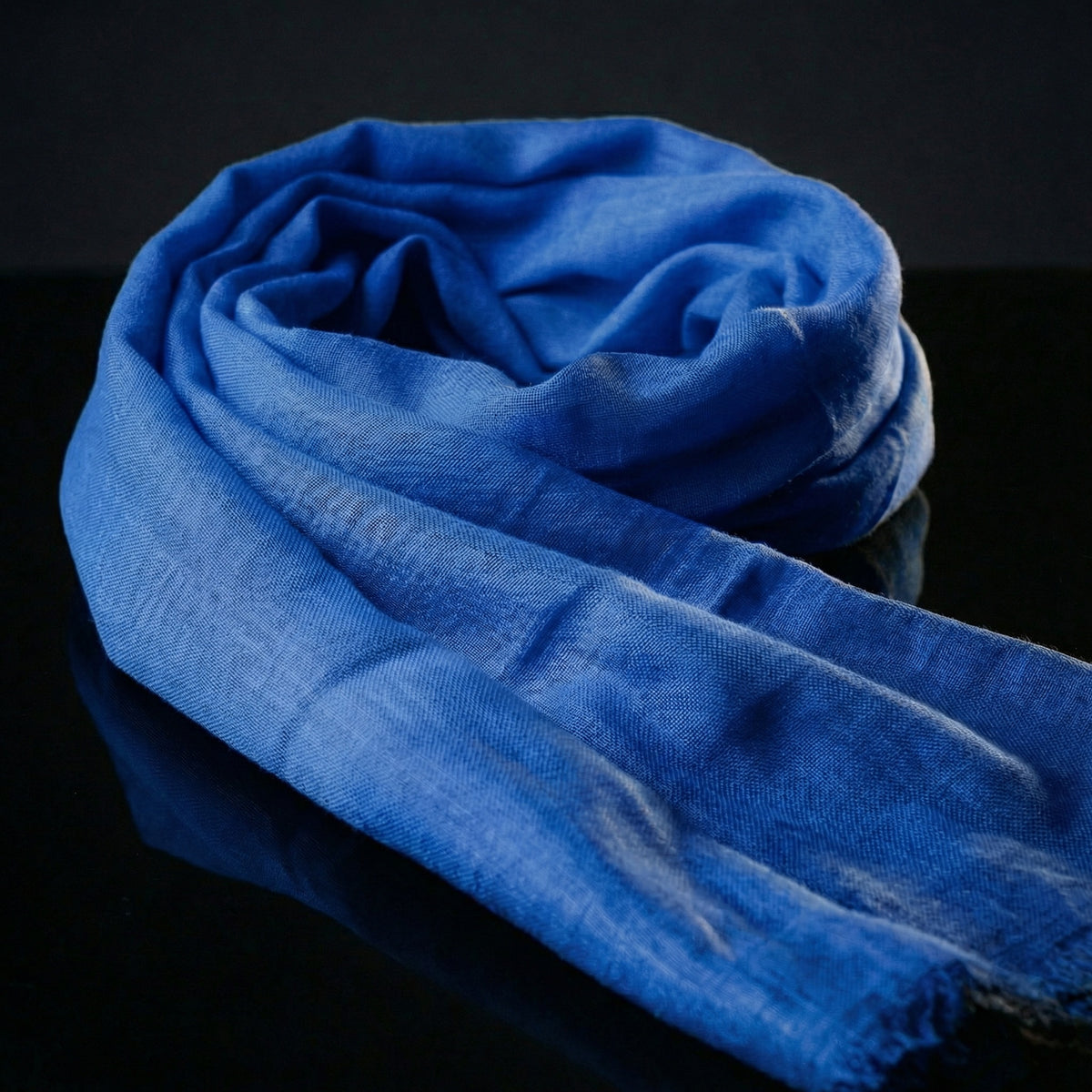 Lightweight indigo blue Tagelmust in rayon fabric, designed as a breathable desert headscarf for Sahara travel and Safari.