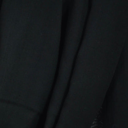 Close‑up of Smoke Black Original Tagelmust scarf fabric – rich deep black Moroccan headscarf, sustainably sourced lightweight weave ideal for nomadic travelers searching for pure black scarves for hot‑weather, dry‑climate adventures.