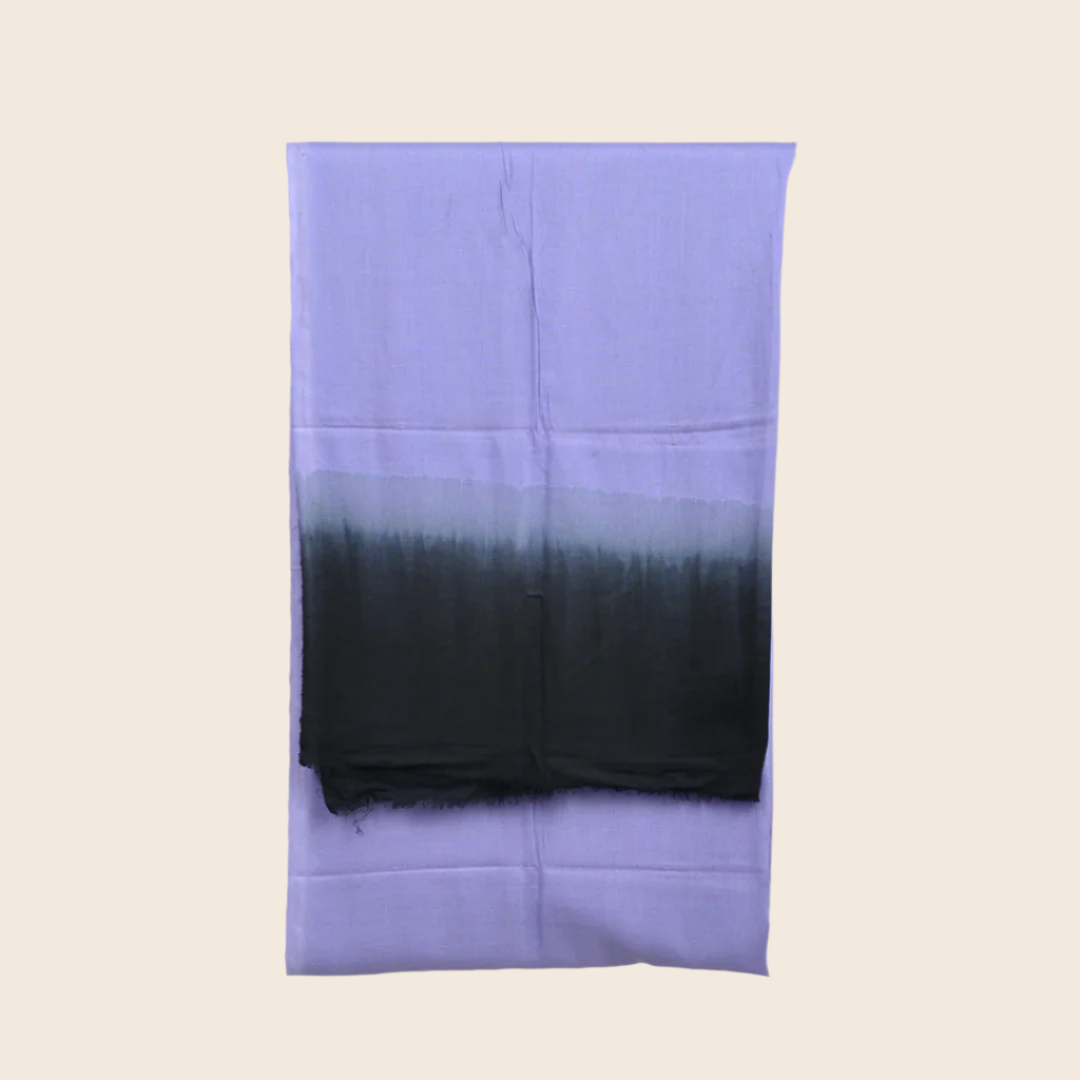 DUNZ Tagelmust Scarf in Vista Blue Soaked – soft lavender‑blue fading to deep charcoal black, sustainably sourced lightweight Moroccan headscarf ideal for travelers seeking lavender, blue, or black scarves for hot‑weather, dry‑climate adventures.